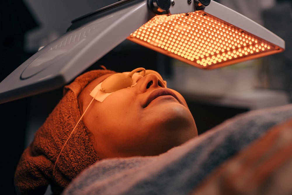 a lady having LED light therapy