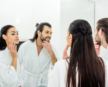 a man and a woman doing skincare together
