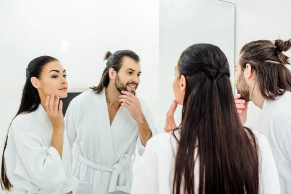 a man and a woman doing skincare together