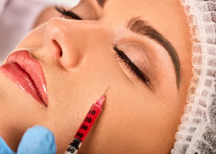 a lady is taking a prp treatment